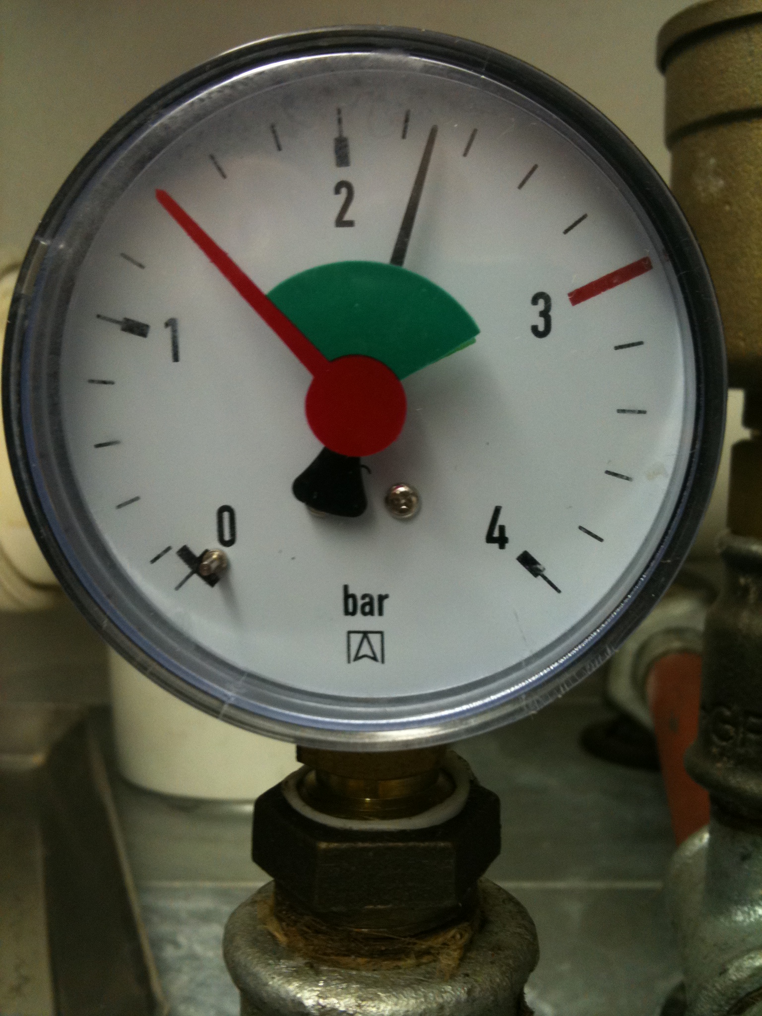 Illustrative analog pressure gauge showing a bar scale and needle; not a pool-specific gauge